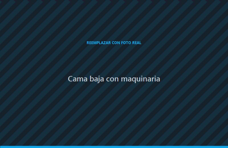 Cama baja transportando maquinaria